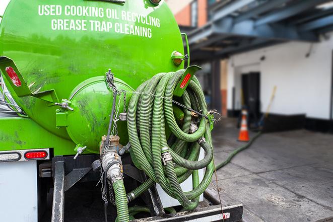 truck pumping out a large grease trap in Scottsdale